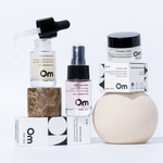 Collection of skincare products with 'Om' branding on a white background